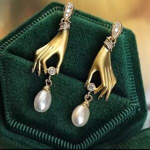 Anthropologie unique Gold Hand Earrings with Pearls